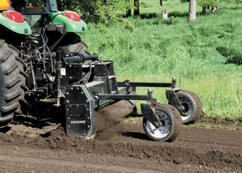 John Deere Tractor Pulling A 3-Point PTO Soil Conditioner