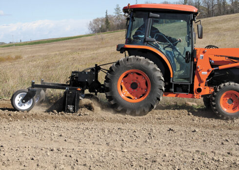 Kubota Tractor Pulling A 3-Point PTO Soil Conditioner