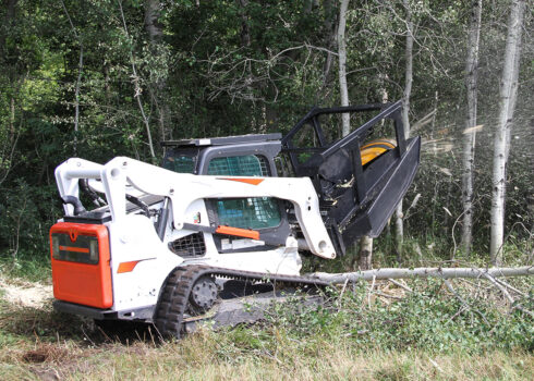 bobcat skid steer pulling forestry mulching mower