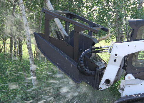 Skid Steer Pulling Forestry Mulching Mower