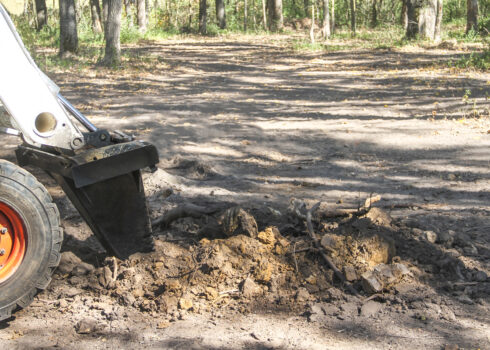 stump bucket digging action